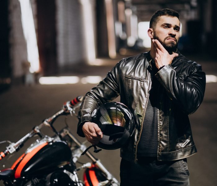 Handsome sexy man on motorbike